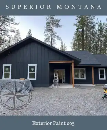 Board-and-batten exterior finished in its new dark paint, Superior, Montana