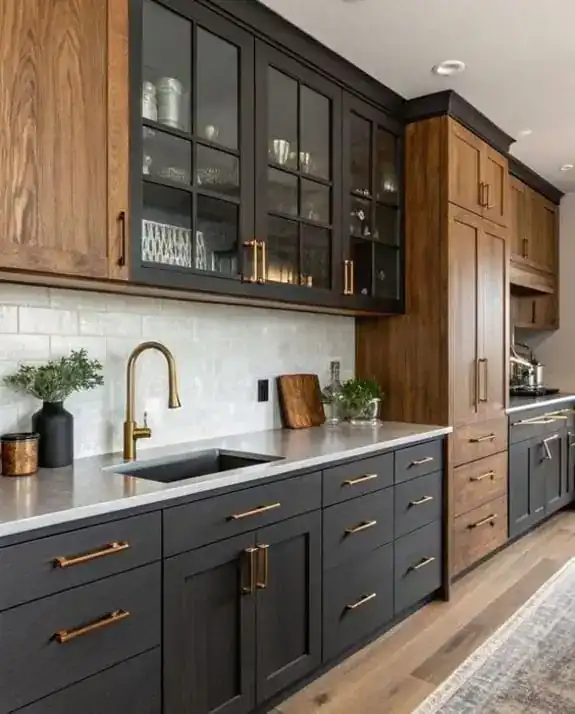 Kitchen with walnut and charcoal cabinetry and a stone counter