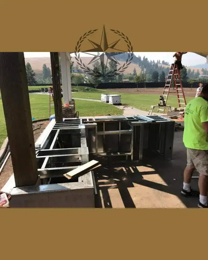 Setting the appliance cabinetry into the outdoor kitchen under a covered patio