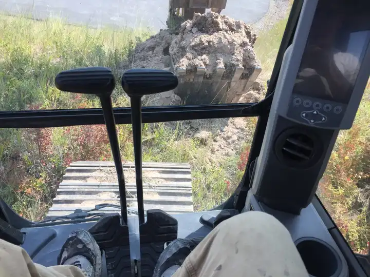 Digging seen from the excavator cab